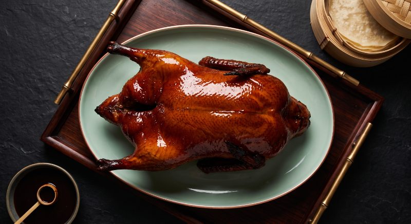 Whole applewood roast Peking duck, carved at the table